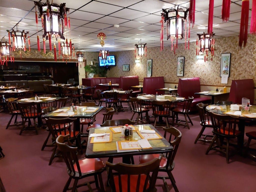 The Golden Moon dining room with red lanterns, booths and family tables