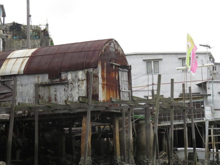Weathered stilt houses over the water in a Hong Kong fishing village